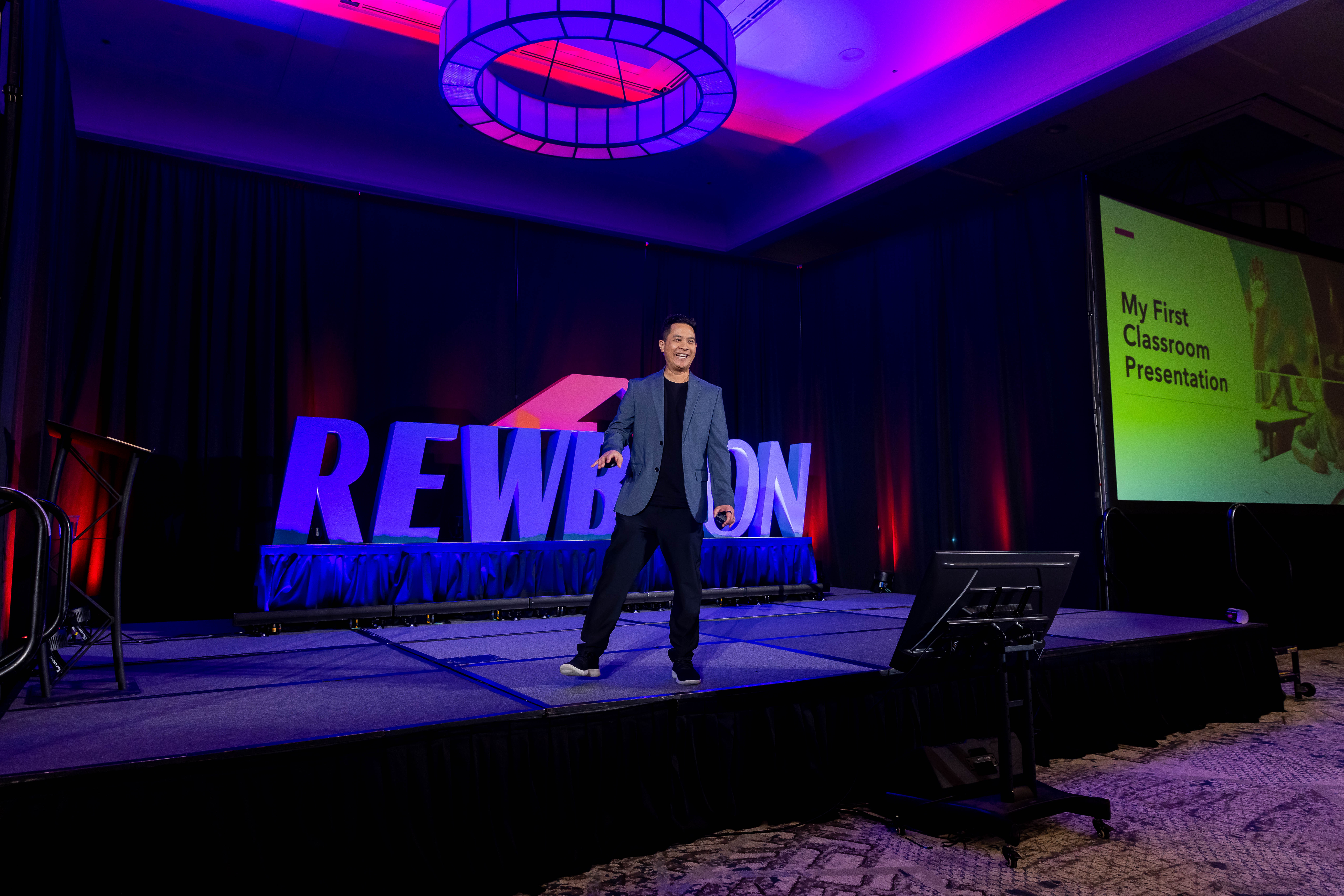 Michael Quan on stage at RewbCon