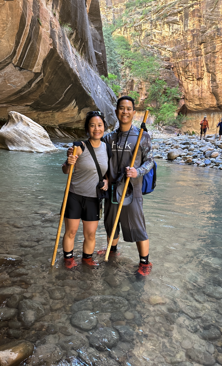 Michael Quan hiking the Zion Narrows