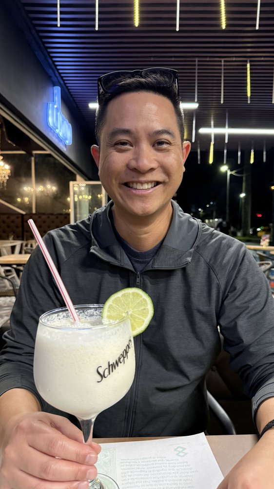 Michael Quan smiling at dinner