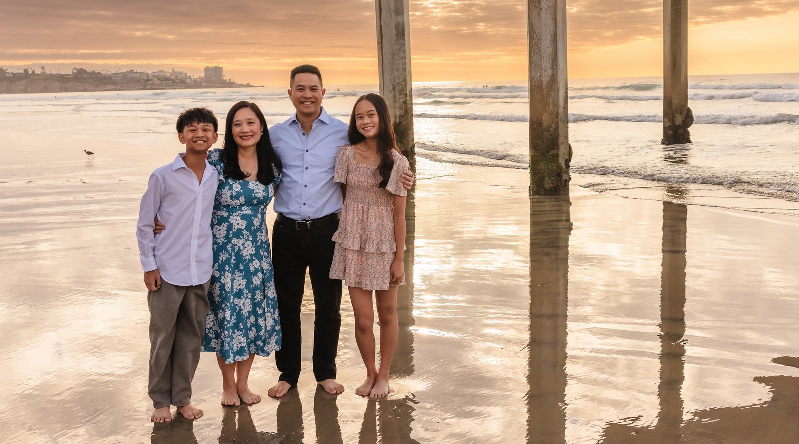 Michael Quan with family on the beach